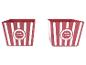 Dve červené nádoby na popcorn s bielymi pruhmi.