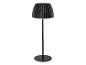 Čierna stojaca lampa s plisovaným tienidlom a okrúhlou základňou.
