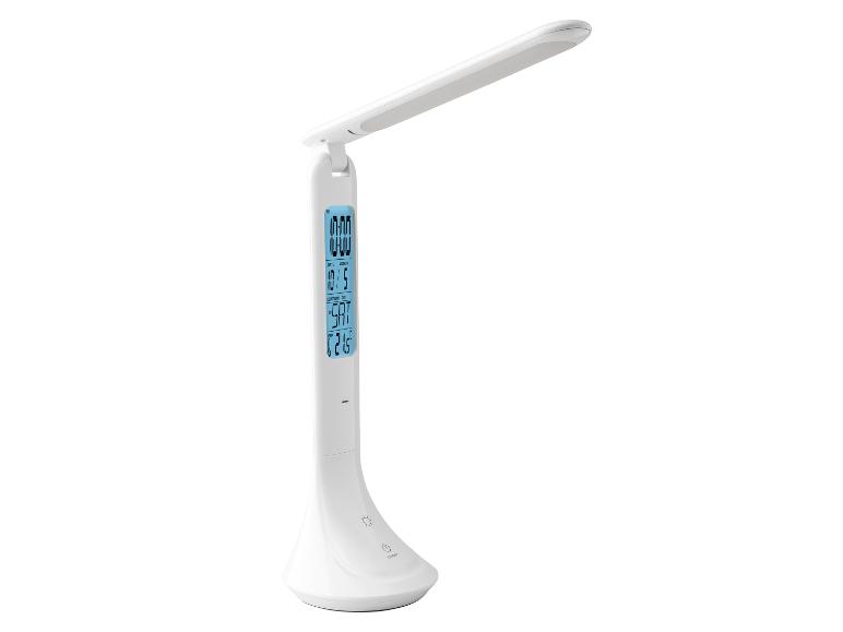 Biela LED stolová lampa s integrovanými hodinami a teplomerom.
