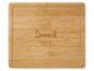 Bambusová krájacia doska s nápisom 'Home Sweet Home'.