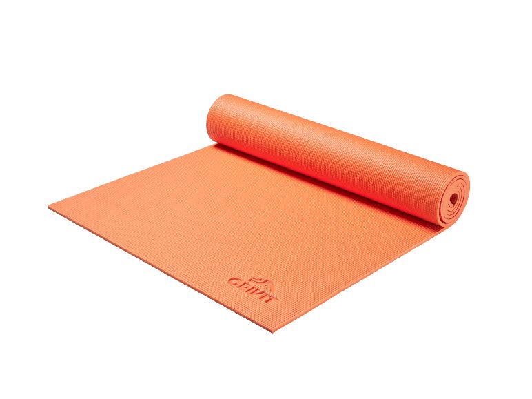 Oranžová podložka na jogu Crivit, čiastočne zrolovaná.
