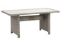Záhradný stôl z ratanu v sivej farbe s bielym vrchom.