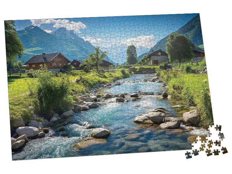 Čiastočne dokončené puzzle zobrazujúce horskú dedinu s riekou a domami.
