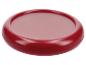Červená okrúhla podložka pod hrniec alebo panvicu.