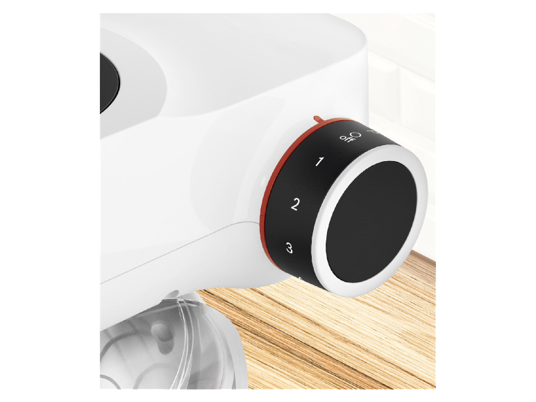 Ovládanie rýchlosti bieleho mixéra s červenými detailmi.