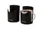 Dva čierne držiaky na hrnčeky PARKSIDE, jeden s hrnčekom kávy
