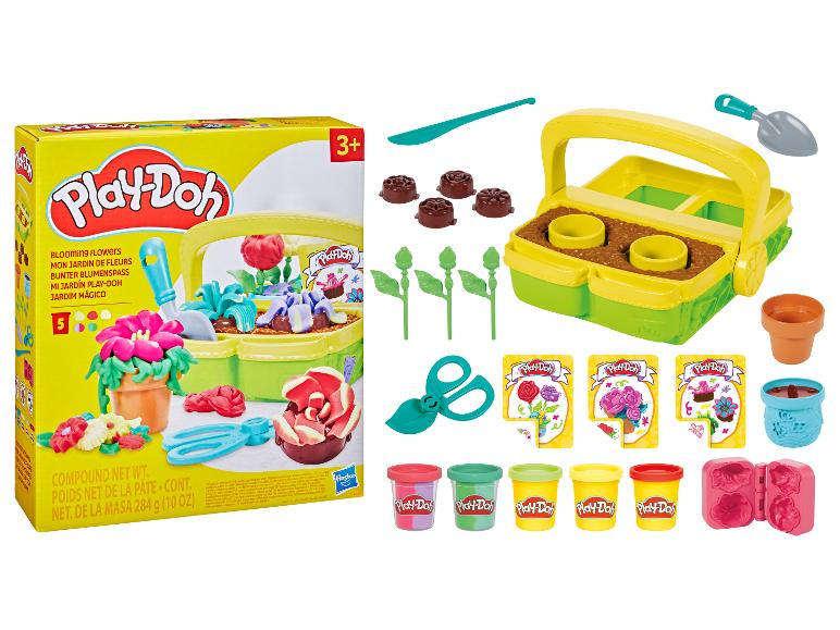 Súprava Play-Doh Blooming Flowers s modelovacou hmotou, záhradným náradím a formičkami na kvety.