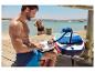 Nafukovací paddleboard a elektrická pumpa Crivit pri vode.