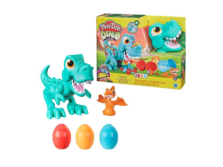 Hračka Play-Doh Dino Crew s dinosaurami, vajíčkami a Play-Doh.