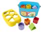 Fisher-Price triedič tvarov s modrým vedrom, žltým triediacim vekom a farebnými tvarmi.