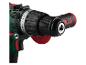 Zelená a čierna elektrická vŕtačka s červenými akcentmi