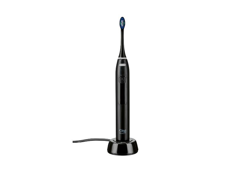 Čierna elektrická zubná kefka Cien Beauty na nabíjacej základni.