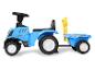Modrý detský traktor New Holland s prívesom.