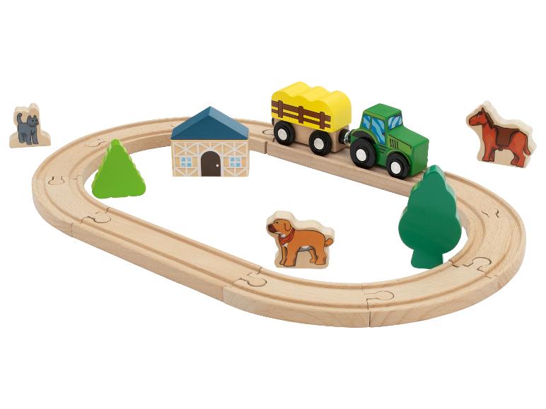 Drevená súprava hračiek s farmárskou tematikou, traktor, vagón, zvieratá a koľajnice.