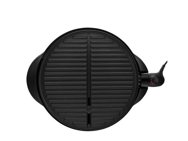 Okrúhla, čierna, elektrická grilovacia panvica: ideálna na grilovanie.