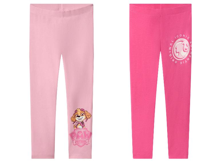 Dvoje detských legín: jedny svetloružové so Skye z Tlapkovej patroly a jedny tmavoružové s logom Barbie.