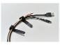 Tri USB káble (Micro-B, Type-A, Type-C) úhľadne usporiadané čiernymi suchými zipsami.
