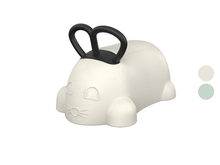 Detská skákacia hračka v tvare bieleho zajaca s čiernymi rúčkami.