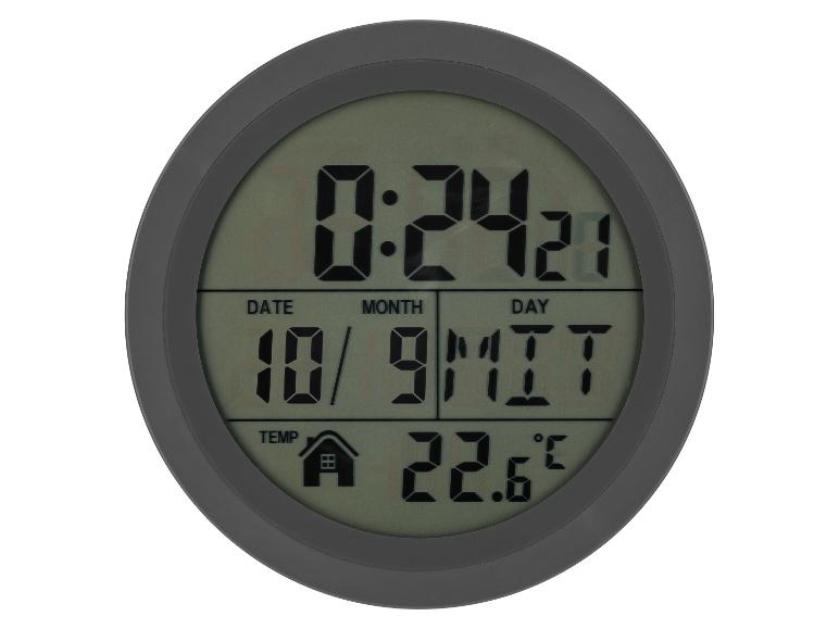 Okrúhle digitálne hodiny zobrazujúce čas, dátum a teplotu.