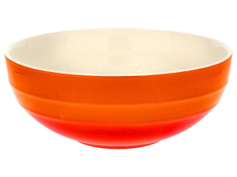 Oranžová a krémová miska s horizontálnymi drážkami.