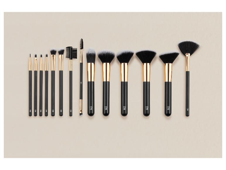 Sada 12 čiernych a zlatých štetcov na make-up v rôznych veľkostiach.