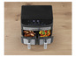 Air fryer Gourmetmaxx s pečeným kuracím mäsom a zeleninou.