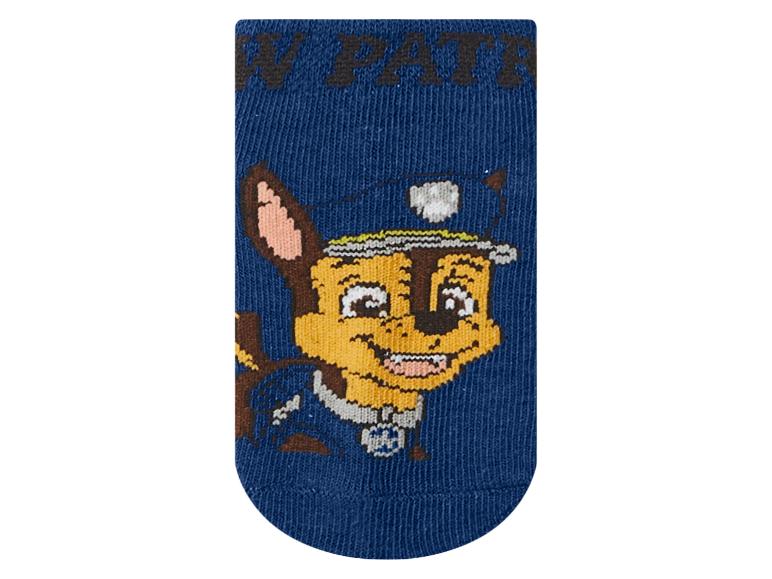 Modrá ponožka s motívom kresleného policajného psa.