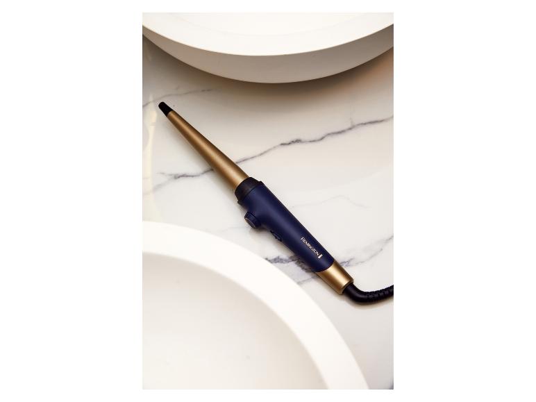 Kulma Remington, zlatá a tmavomodrá, na mramore.