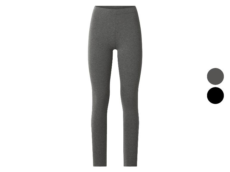 Dámske legíny v sivej a čiernej farbe, s elastickým pásom.