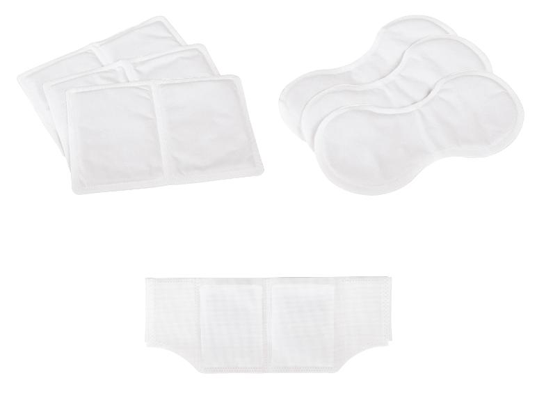 Biele jednorazové vložky a podložky pre inkontinenčné alebo hygienické produkty.