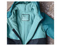 Turquoise bunda s kapucňou a čiernymi detailmi.