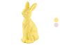 Žltá figúrka veľkonočného zajačika s dvoma vzorkami farieb vpravo.