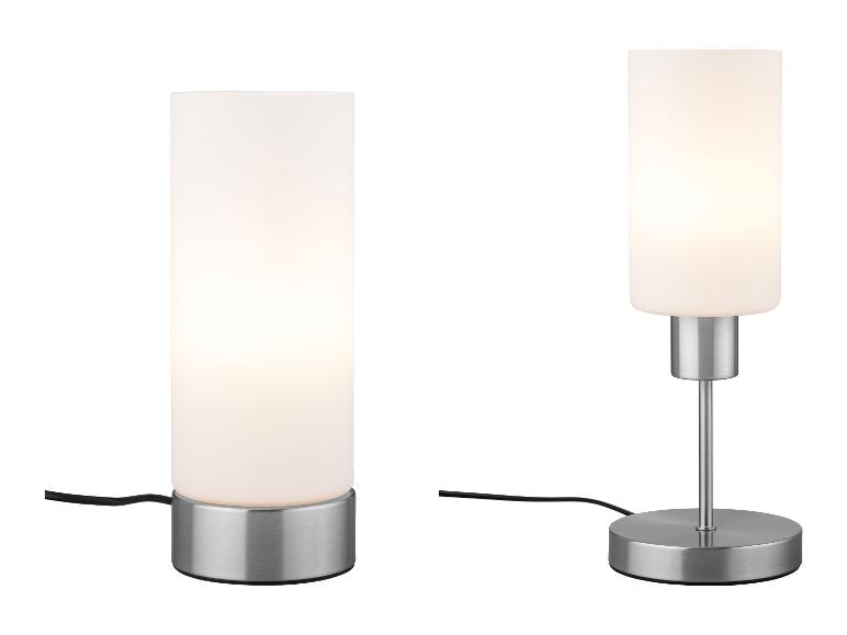 Dve moderné stolové lampy s valcovými tienidlami z matného skla a kovovými základňami.