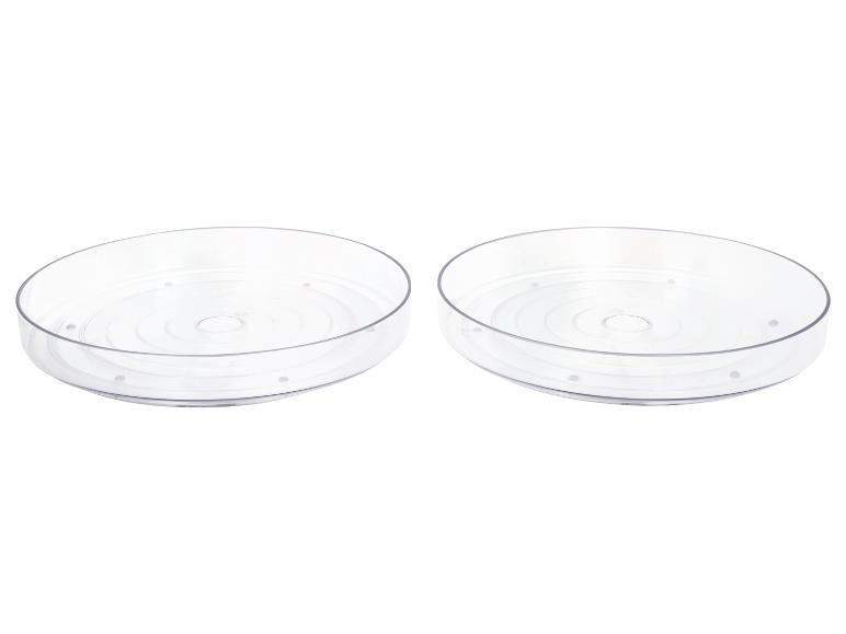 Dva priehľadné, okrúhle úložné podnosy.
