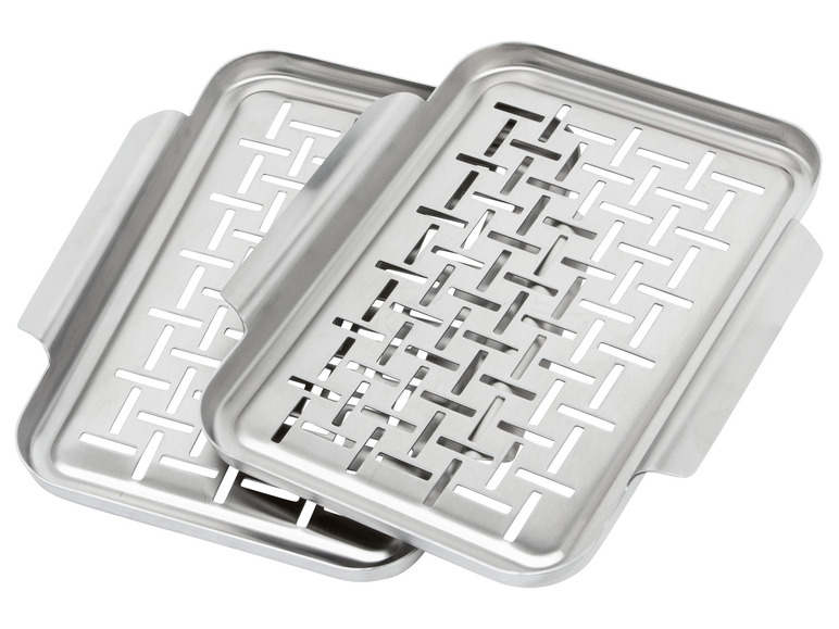 Dve nerezové odkvapkávacie tácky na umývadlo.