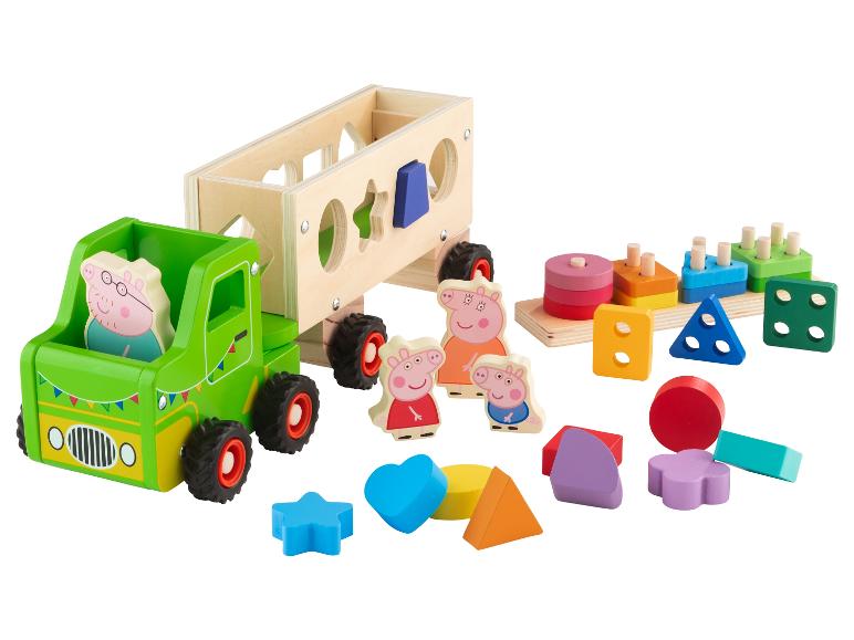 Hračka zelená nákladná dodávka s figúrkami Peppa Pig a farebnými kockami.