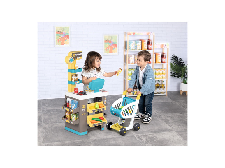 Detská hračka s obchodom a nákupným košíkom.