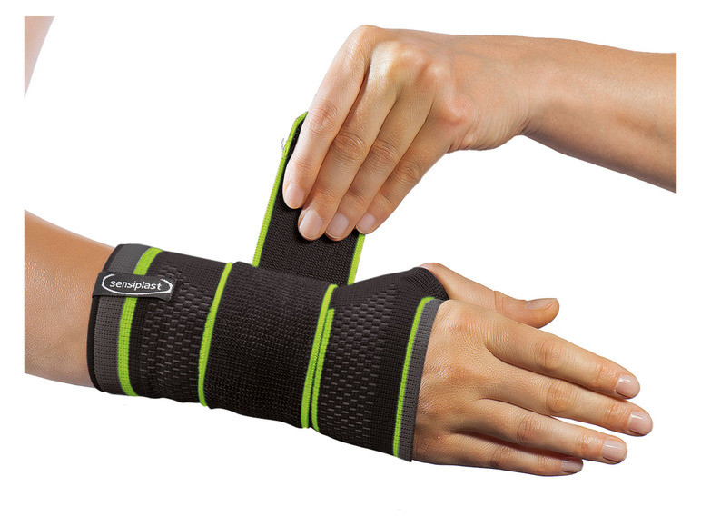 Čierna oporná bandáž na zápästie Sensiplast so zelenými detailmi.