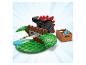 LEGO dinosaurus s červenými ostňami, hnedou štruktúrou a prepravkou modrých diskov.