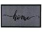 Sivá rohožka s čiernym okrajom a nápisom „home“.