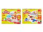 Dve sady Play-Doh: veterinárna súprava s figúrkami zvierat a stavebná a tvarovacia súprava s nástrojmi.