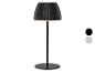 Čierna stolná lampa s plisovaným tienidlom a dvoma farebnými variantmi.