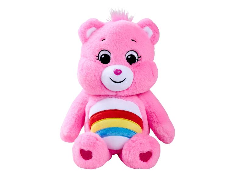 Ružový plyšový medvedík Care Bear s dúhou na bruchu.