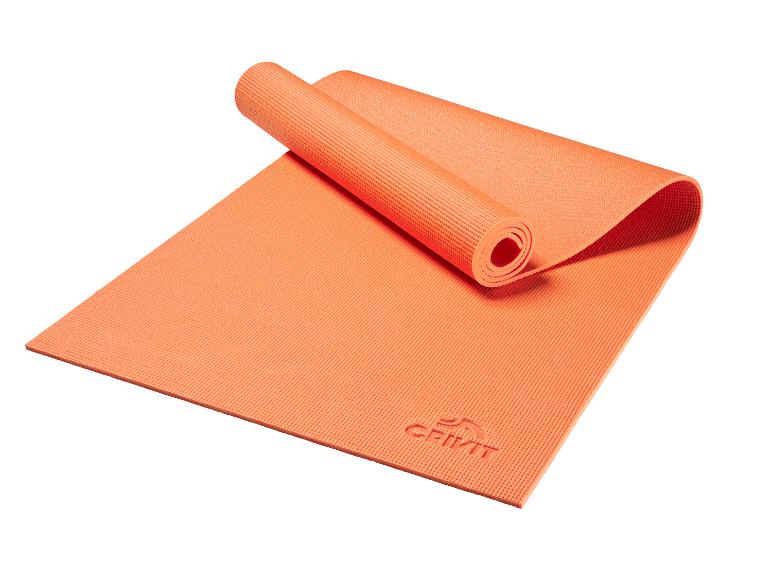 Oranžová podložka na jogu Crivit, čiastočne zrolovaná.