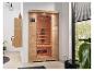 Infrasauna HOME DELUXE v modernej kúpeľni s drevenými skrinkami a rastlinami.