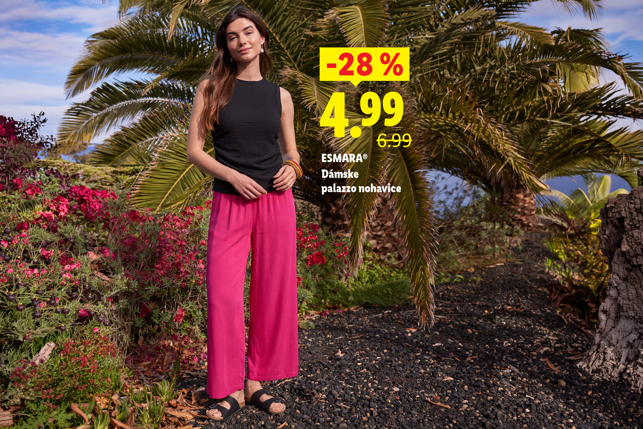 Žena v čiernom tope a ružových palazzo nohaviciach, s cenou -28% za 4,99.