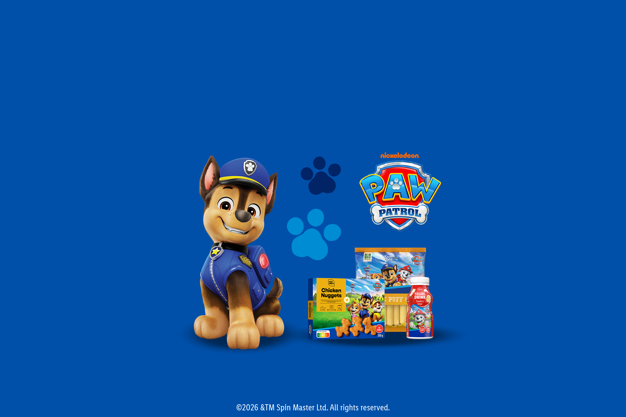 Postavy Tlapkovej patroly s kuracími nugetkami, jogurtovým nápojom a organickou pufovanou kukuricou.